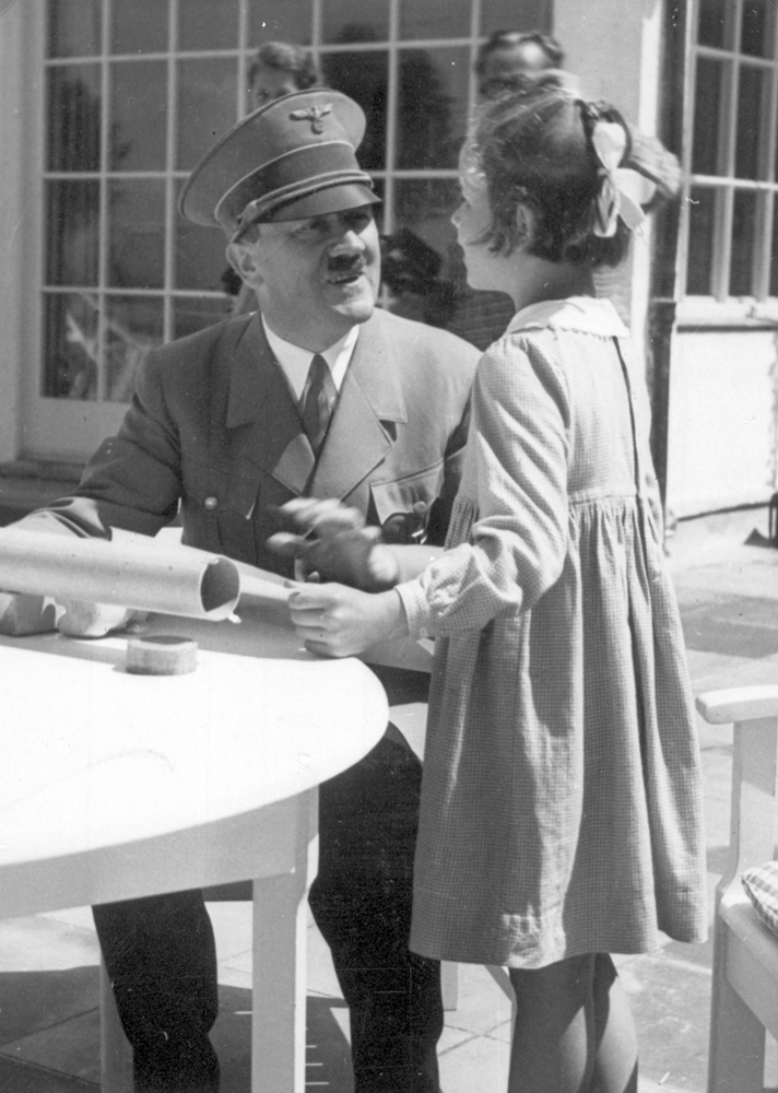Adolf Hitler with a little girl on the terrace of Haus Wachenfeld, from Eva Braun's albums